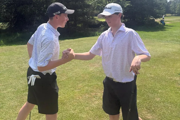 Play off protagonists greet each other on the tee